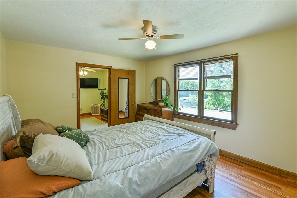 161 Gore Road Webster, MA 01570 - Photo 31 of 42 a bed sitting in a bedroom next to a window