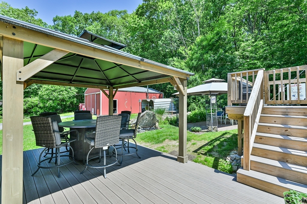161 Gore Road Webster, MA 01570 - Photo 7 of 42 a view of deck with chairs and wooden floor