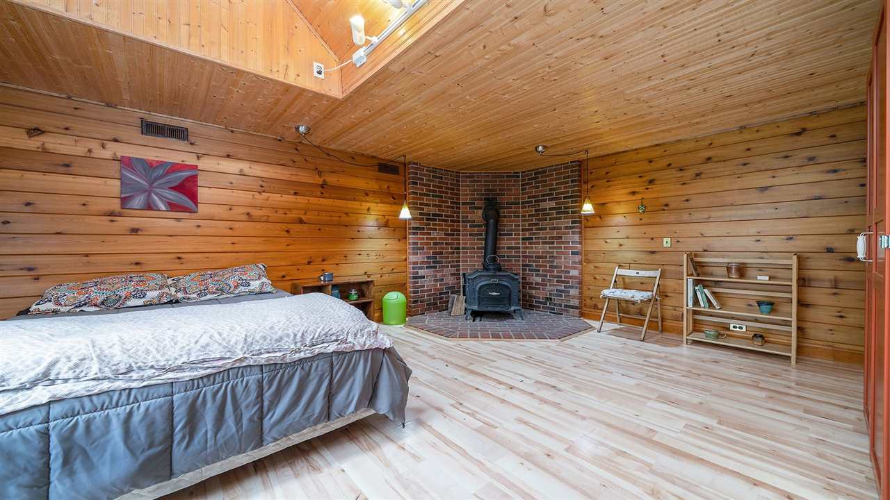 6315 North River Road Byron, IL 61010 - Photo 13 of 40 a bedroom with furniture and wooden floor