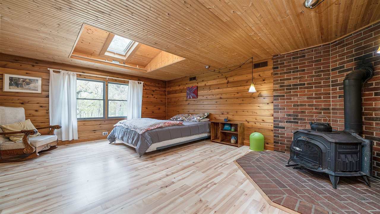 6315 North River Road Byron, IL 61010 - Photo 14 of 40 a spacious bedroom with a bed and a balcony