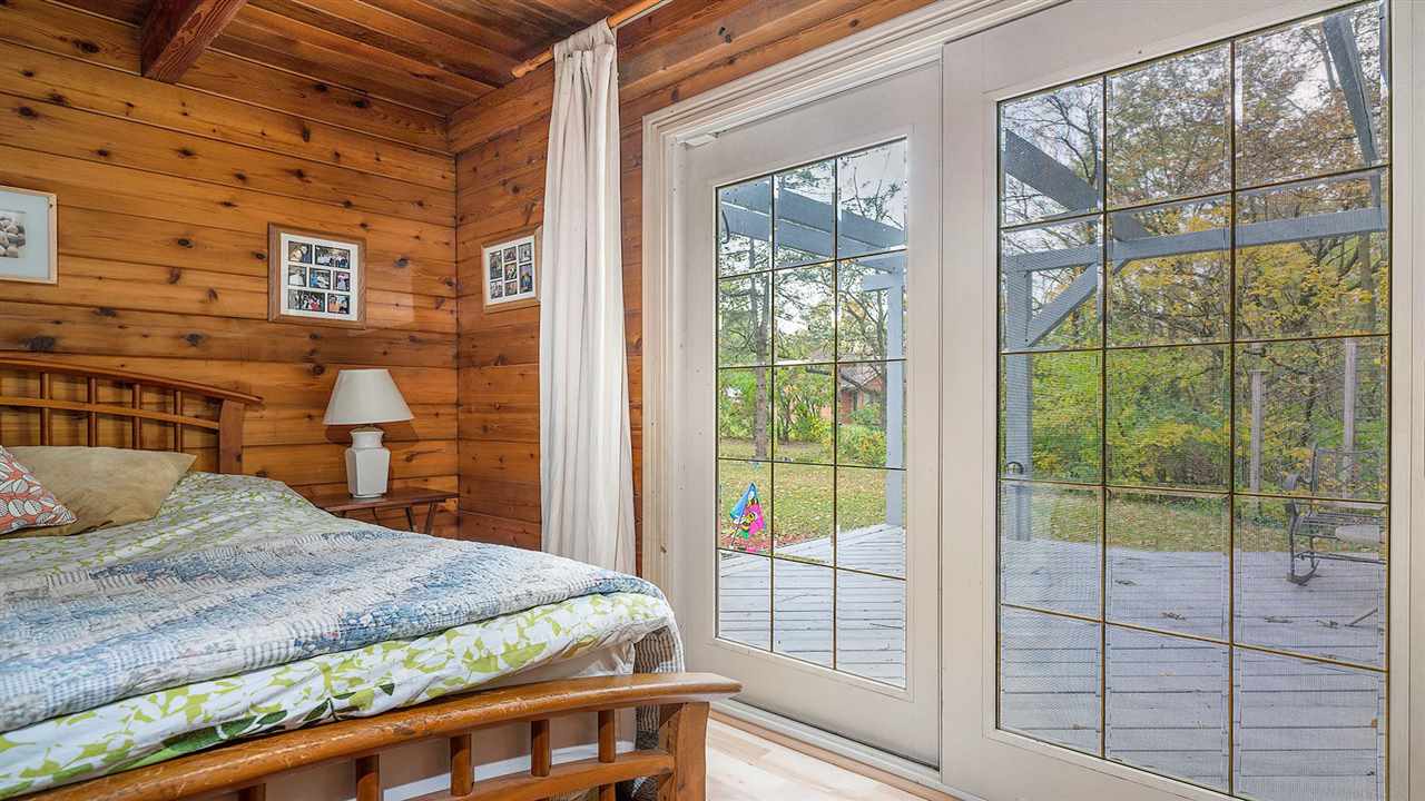 6315 North River Road Byron, IL 61010 - Photo 18 of 40 a bedroom with a bed and a large window