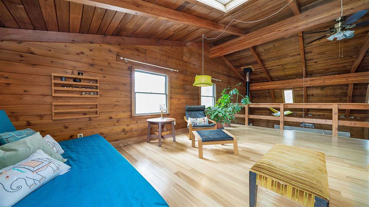 6315 North River Road Byron, IL 61010 - Photo 28 of 40 a view of a patio with table and chairs with wooden floor and fence