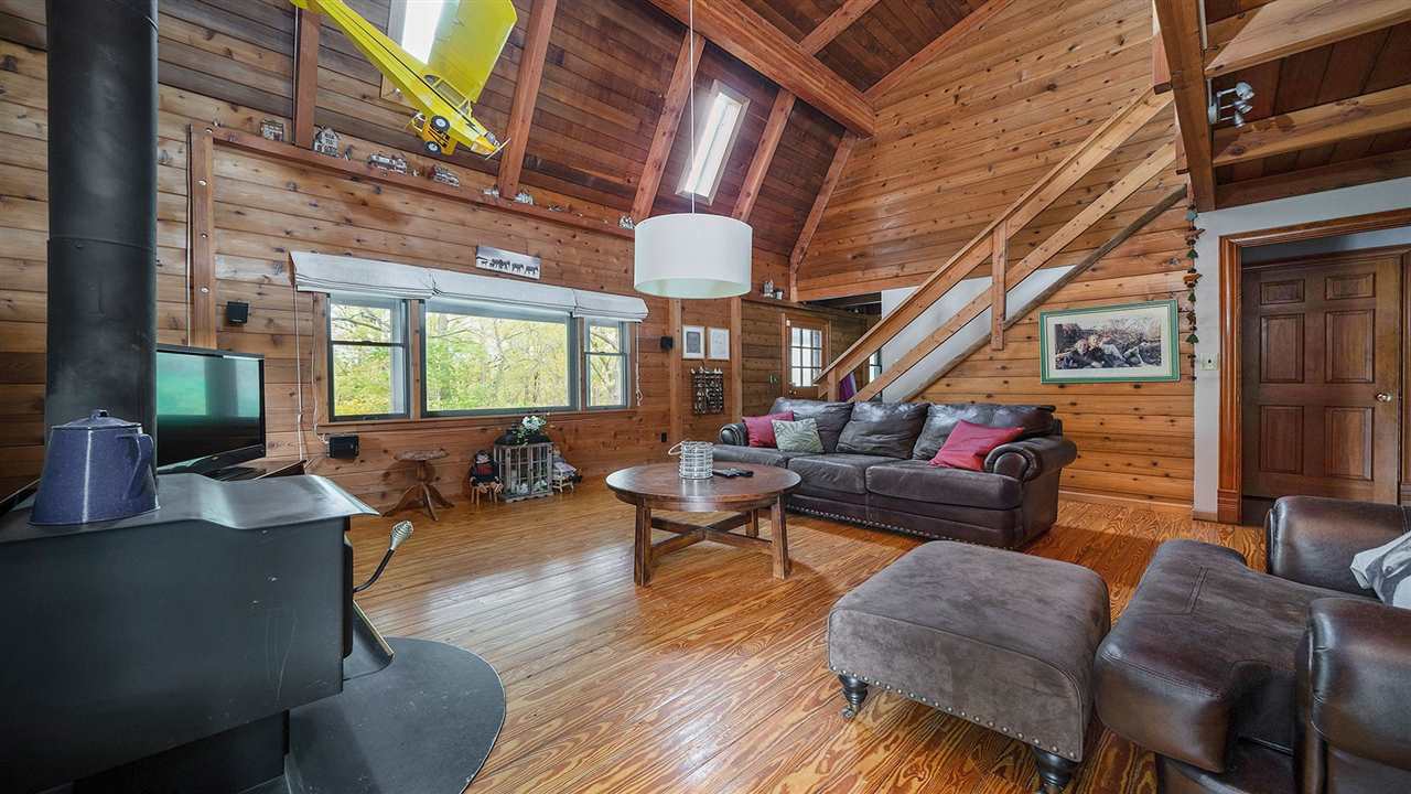 6315 North River Road Byron, IL 61010 - Photo 3 of 40 a living room with furniture and a large window