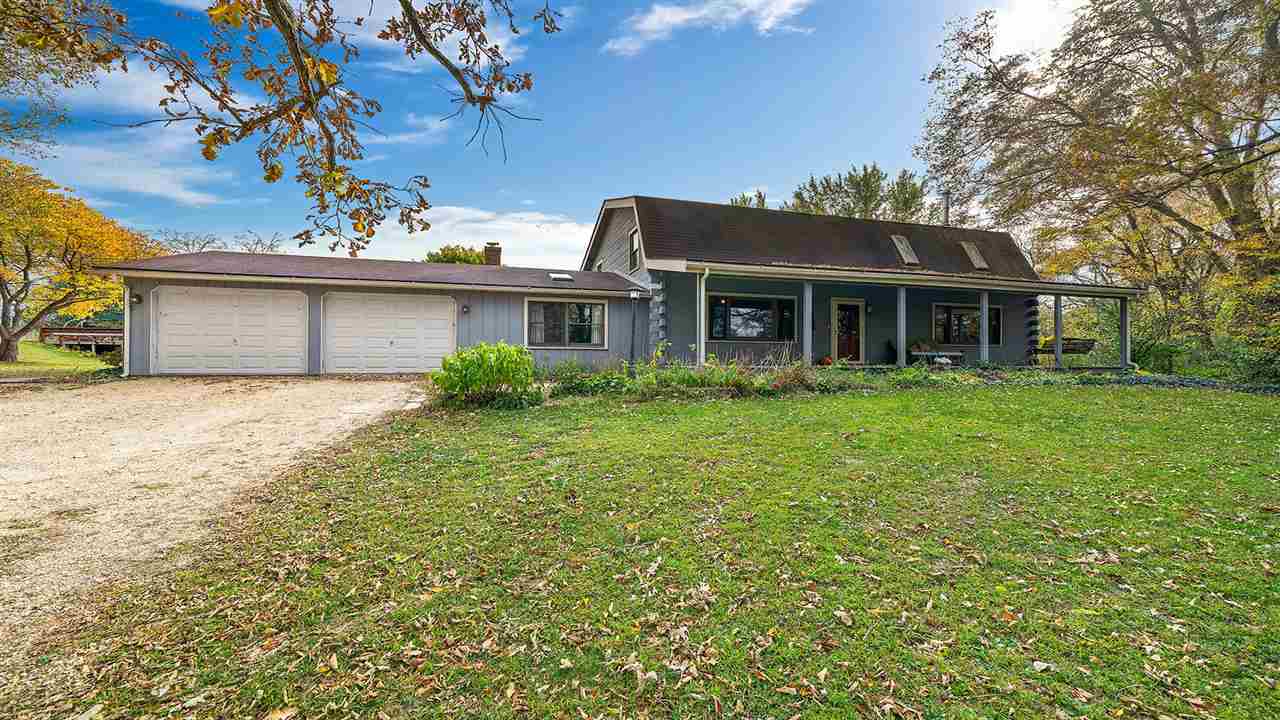 6315 North River Road Byron, IL 61010 - Photo 32 of 40 front view of a house with a yard