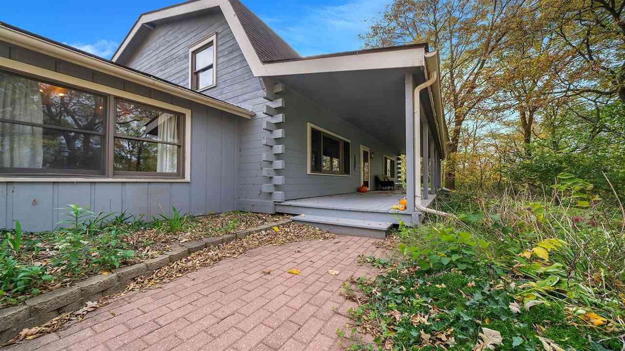 6315 North River Road Byron, IL 61010 - Photo 33 of 40 front view of a house with a small yard