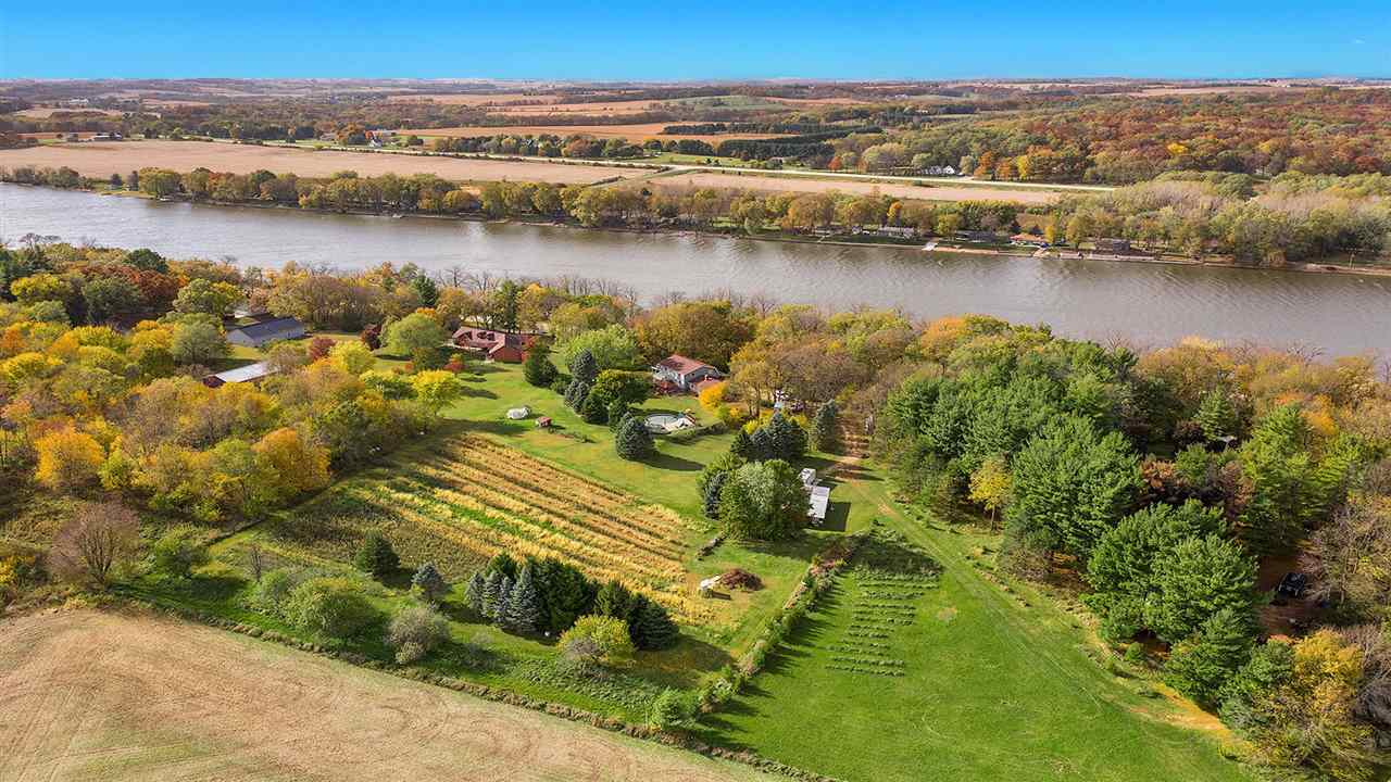 6315 North River Road Byron, IL 61010 - Photo 39 of 40 a view of a lake with a city