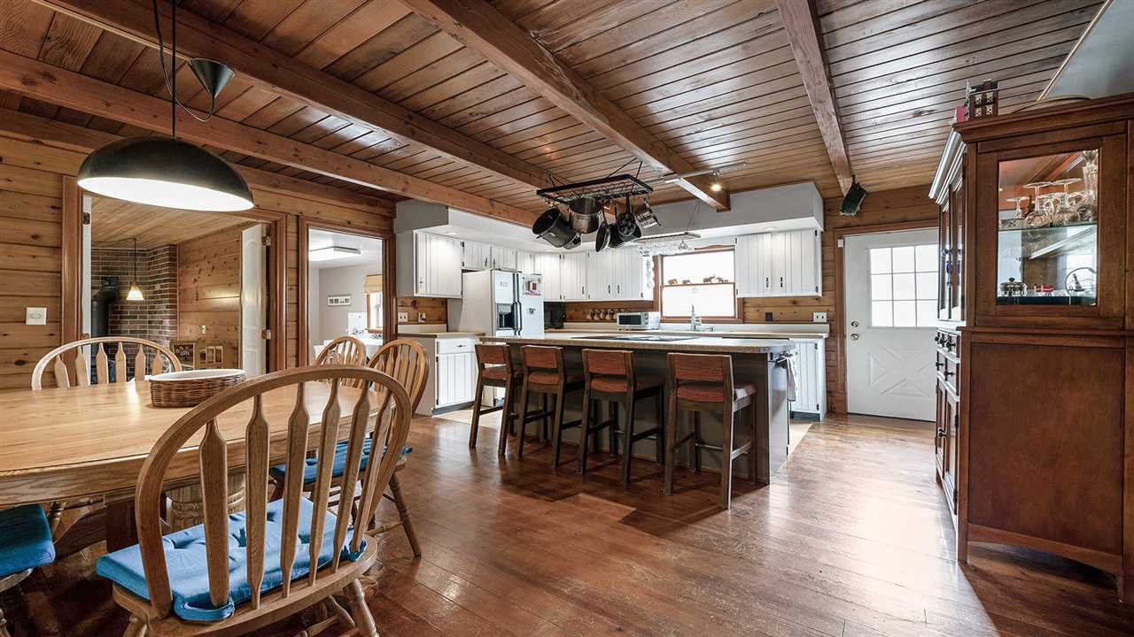 6315 North River Road Byron, IL 61010 - Photo 8 of 40 a dining table with chairs and wooden floor