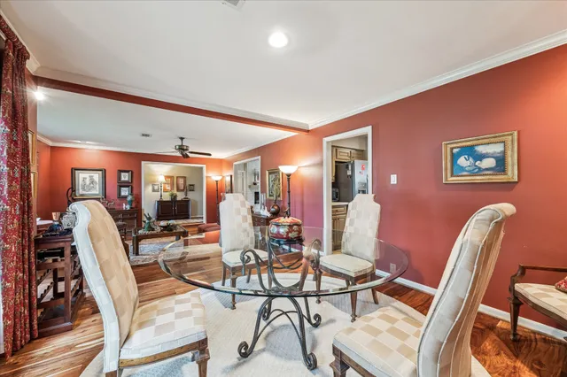 a living room with furniture a rug and a flat screen tv