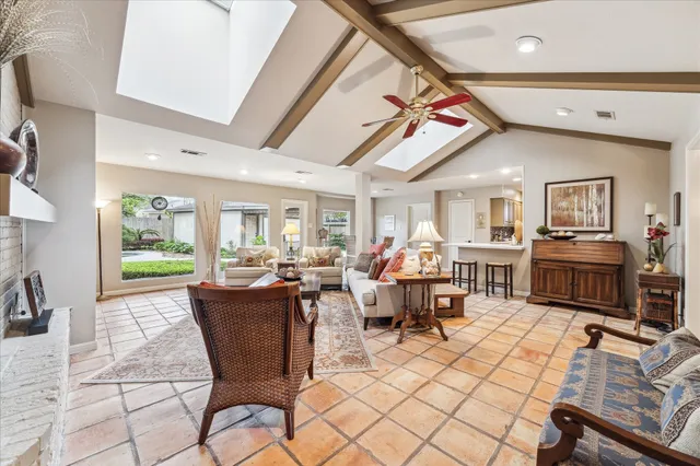 a living room with furniture or couch and a large window