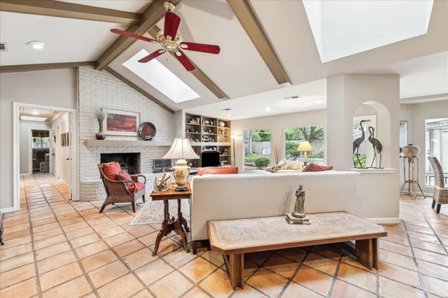 a view of a dining room with furniture and a chandelier