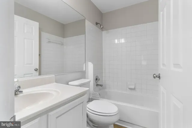 a bathroom with a sink a toilet and a bathtub