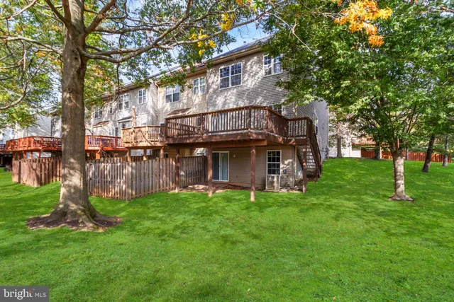 a view of a house with a yard porch and sitting area