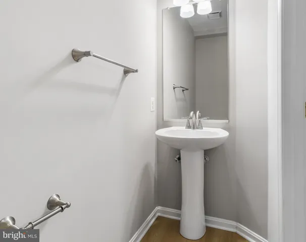 a bathroom with a sink toilet