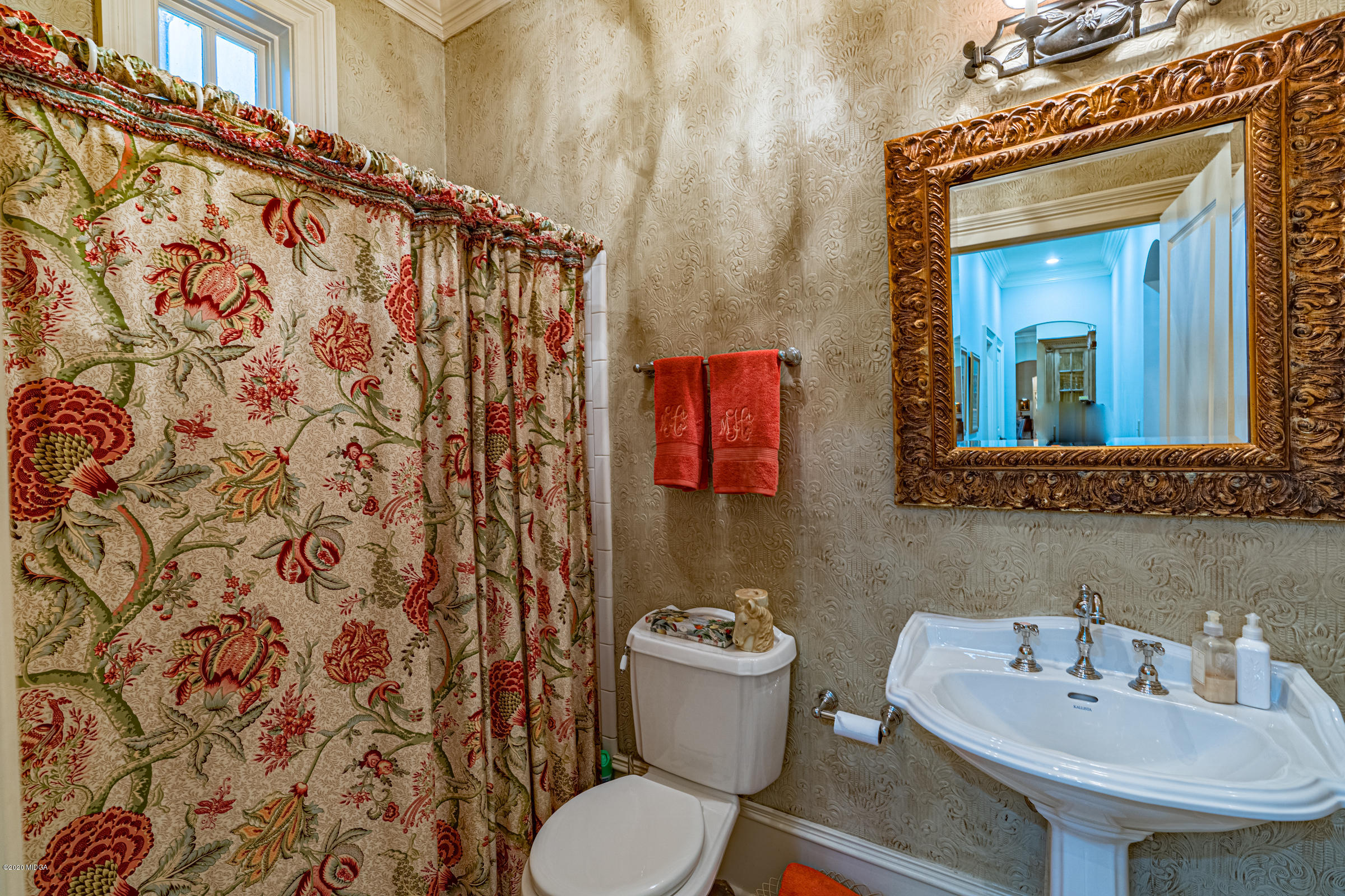 265 Sanders Road Macon, GA 31210 - Photo 31 of 61 a bathroom with a sink and a mirror