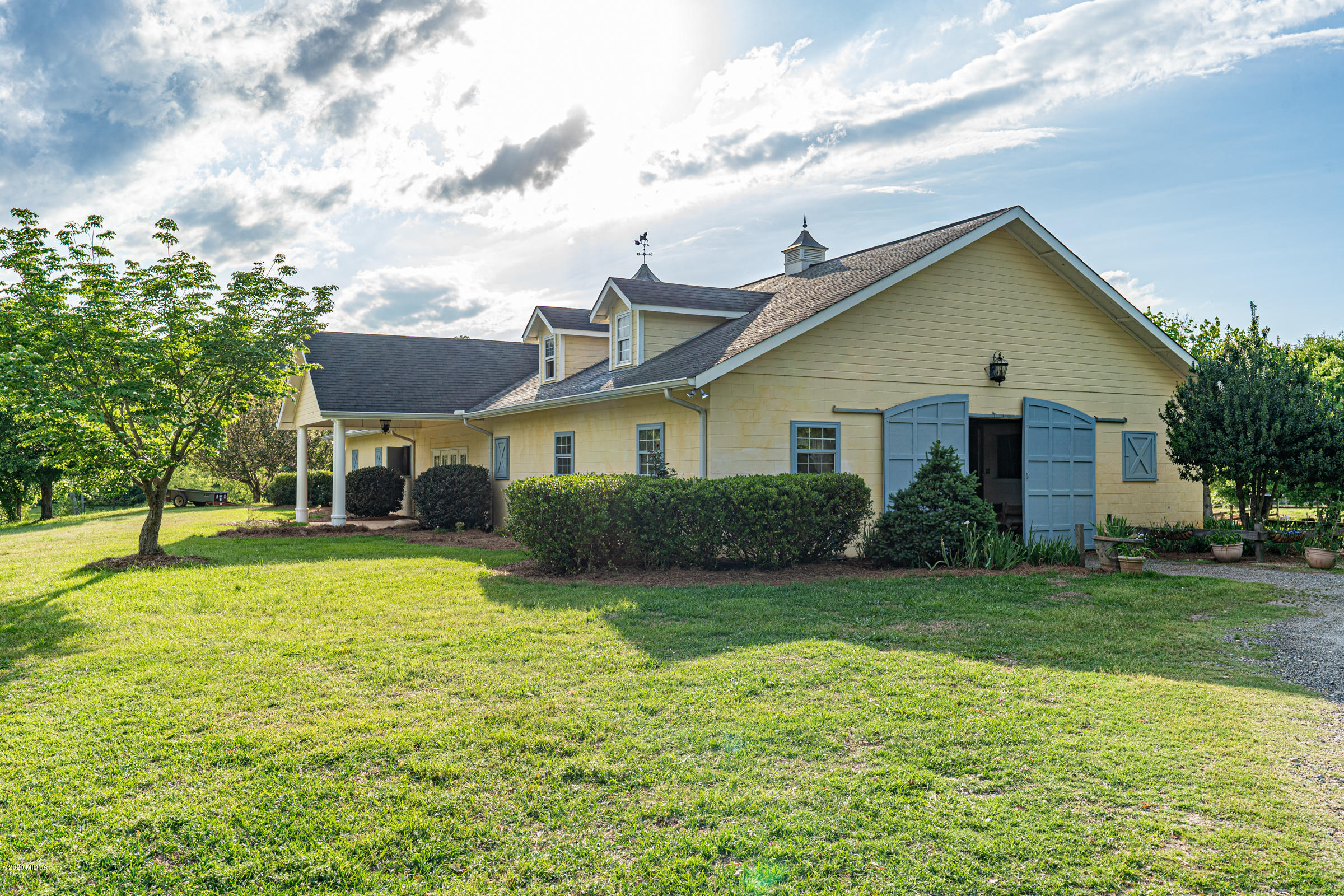 265 Sanders Road Macon, GA 31210 - Photo 38 of 61 a view of a house with a yard patio and fire pit