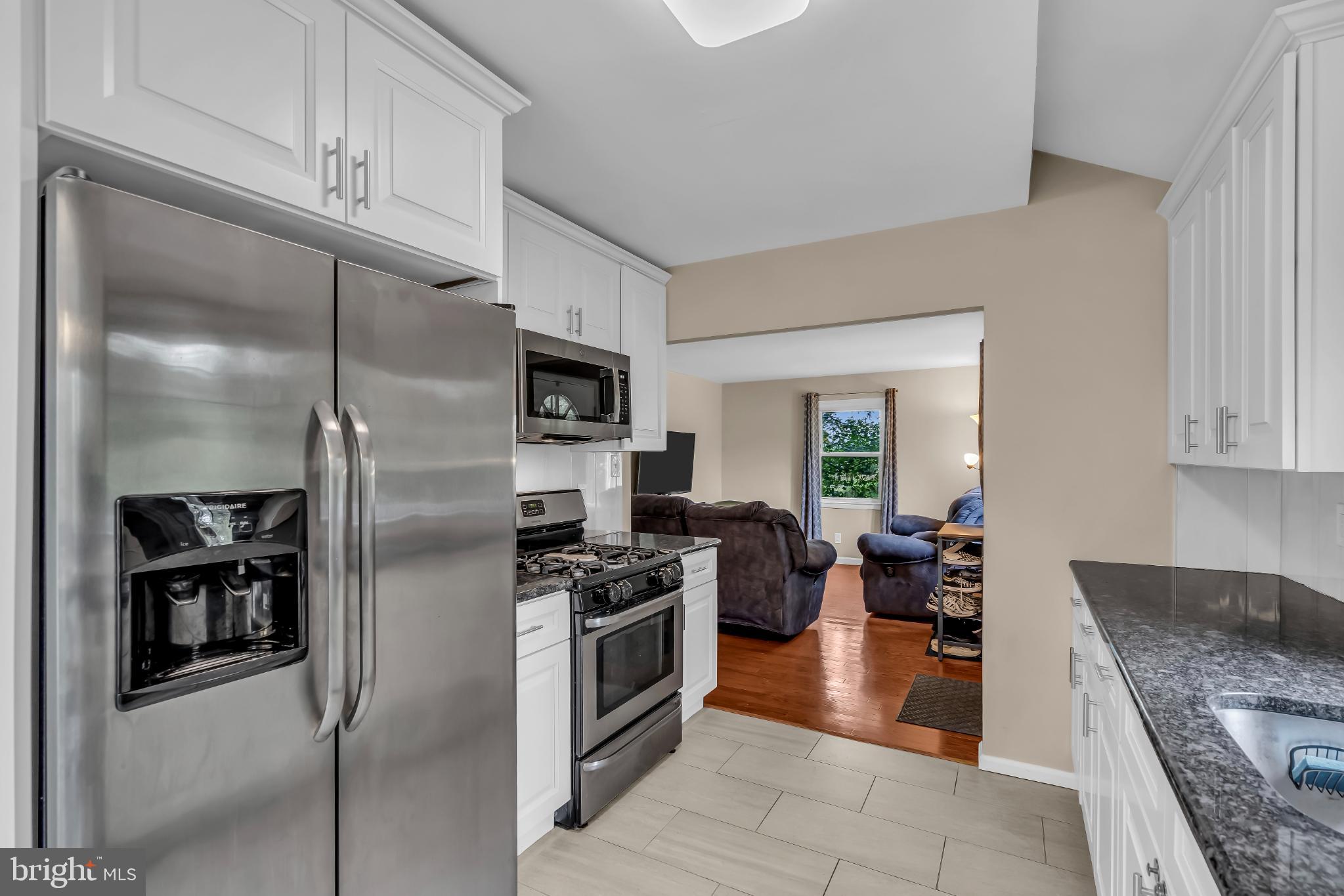 2002 South Brighton Avenue Clementon, NJ 08021 - Photo 13 of 38 a kitchen with granite countertop a refrigerator stove and oven