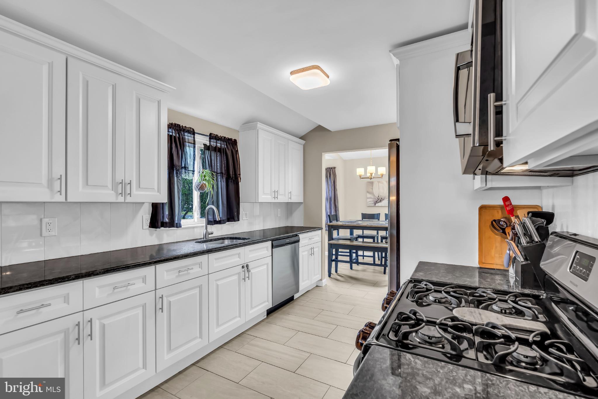 2002 South Brighton Avenue Clementon, NJ 08021 - Photo 16 of 38 a kitchen with sink stove and cabinets