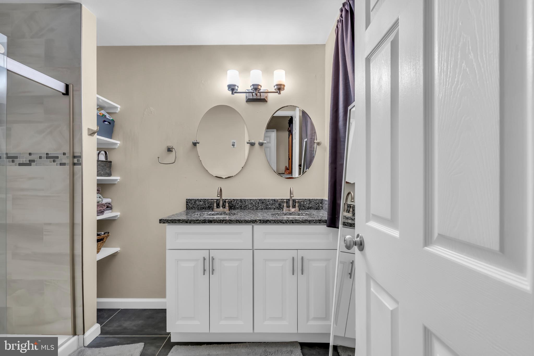 2002 South Brighton Avenue Clementon, NJ 08021 - Photo 29 of 38 a bathroom with a granite countertop sink and a mirror