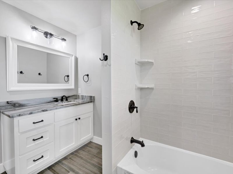 2719 Post Oak Road Webberville, TX 78653 - Photo 12 of 23 a bathroom with a sink a toilet and shower