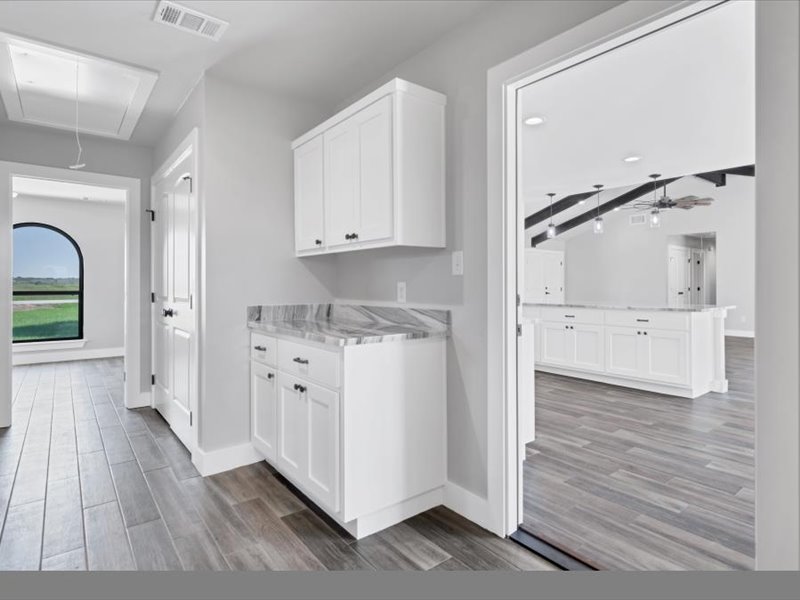 2719 Post Oak Road Webberville, TX 78653 - Photo 17 of 23 a view of a kitchen with wooden floor