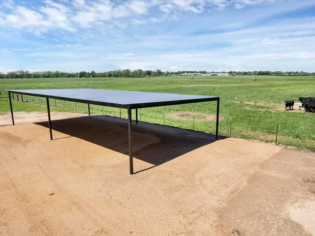 a view of a kitchen with wooden floor