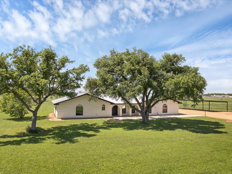2719 Post Oak Road Webberville, TX 78653 - Photo 2 of 23 a front view of house with yard