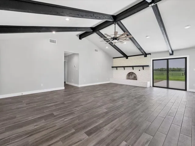 a view of a livingroom with wooden floor