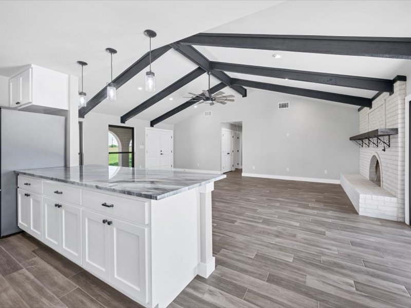 2719 Post Oak Road Webberville, TX 78653 - Photo 23 of 23 a bathroom with a granite countertop sink and a mirror