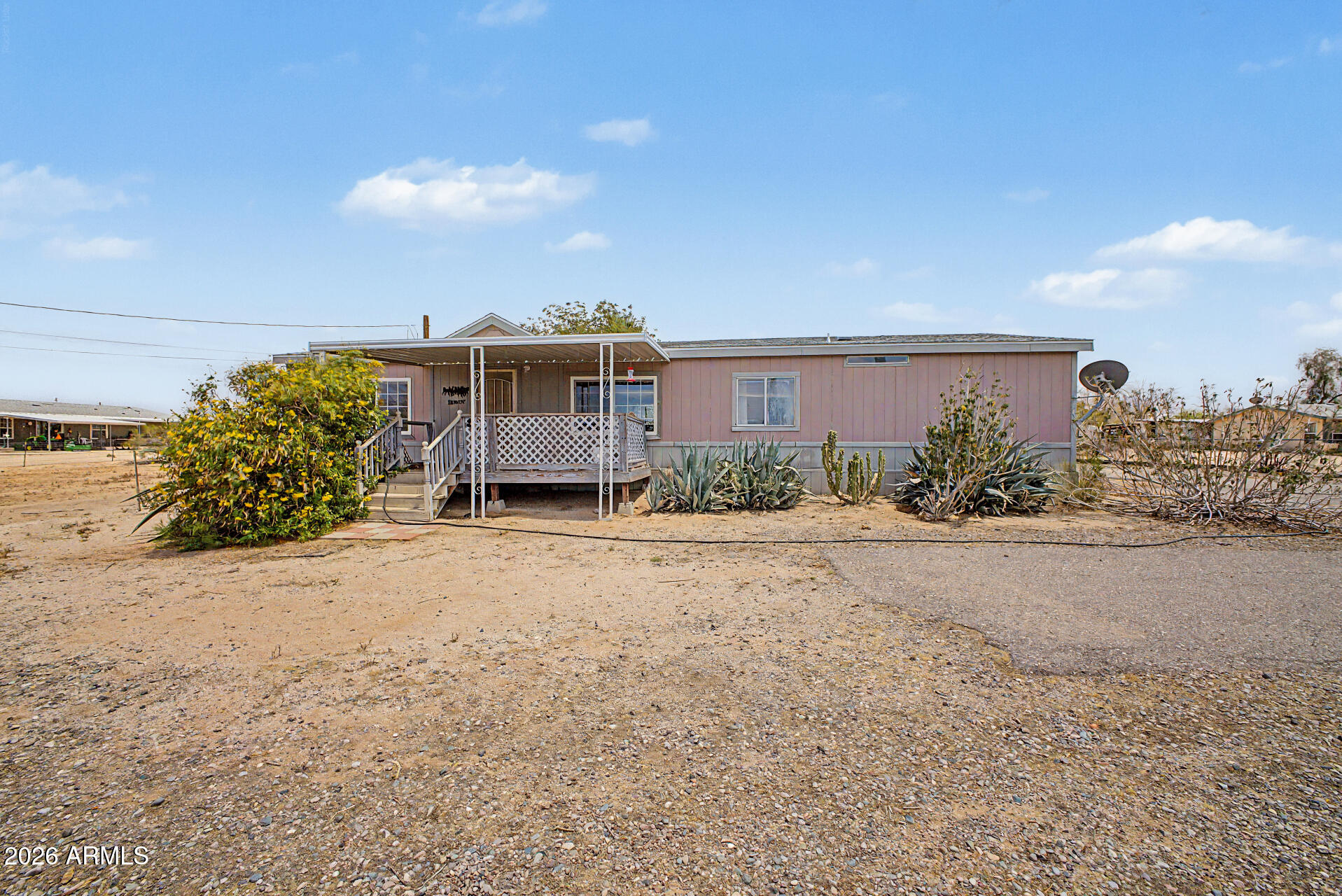 8595 North Palo Verde Road Florence, AZ 85132 - Photo 2 of 41 a view of a house with a yard and potted plants