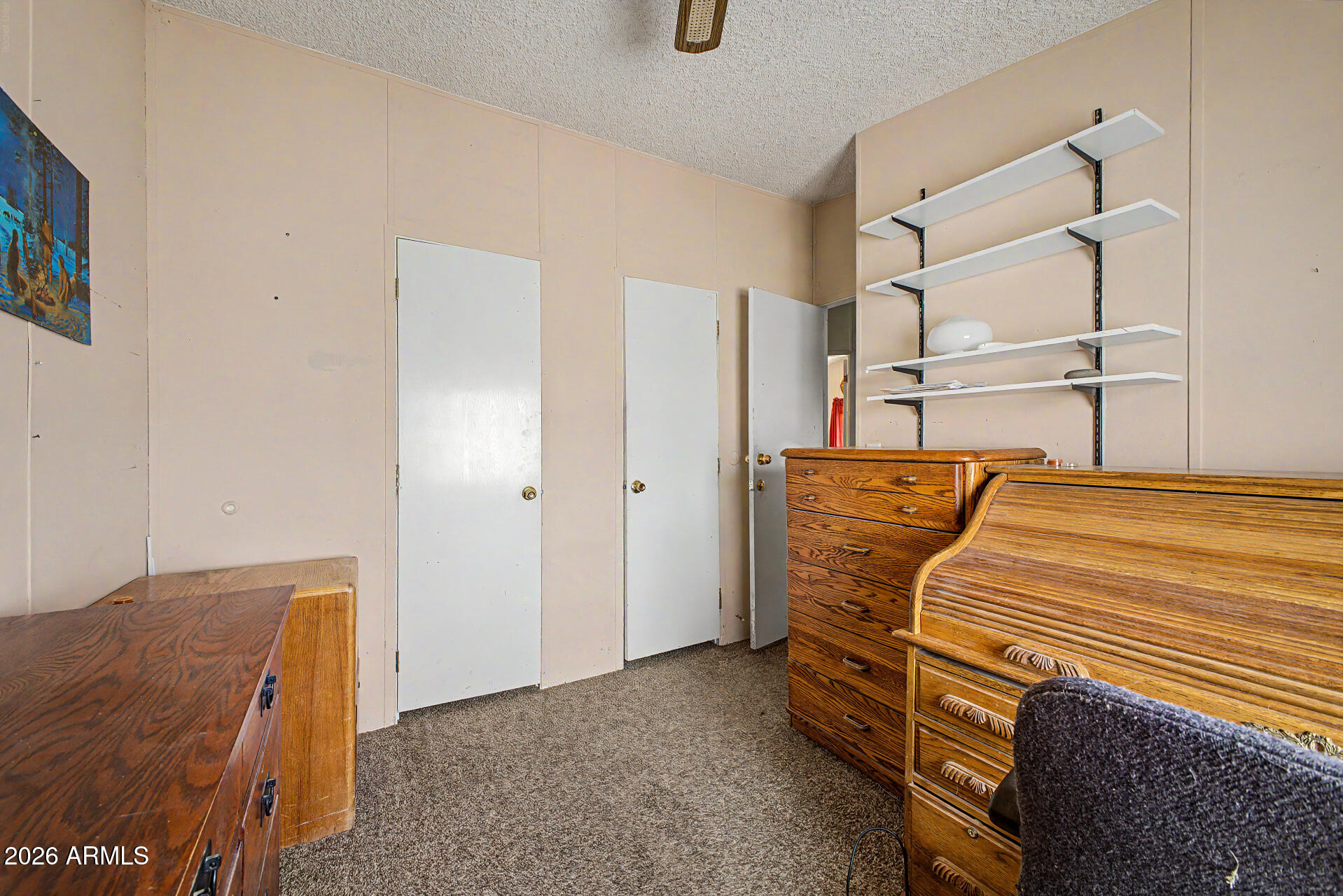 8595 North Palo Verde Road Florence, AZ 85132 - Photo 21 of 41 a bedroom with a bed and a cabinets