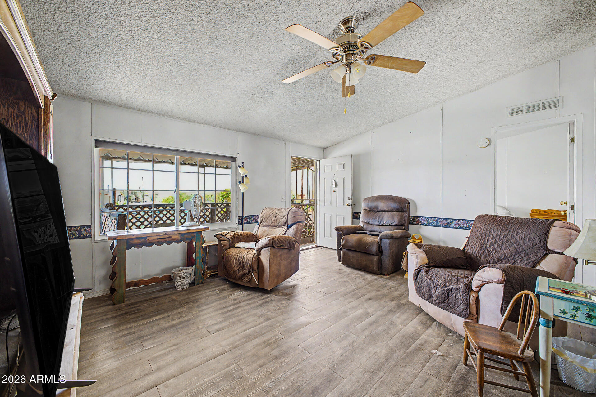 8595 North Palo Verde Road Florence, AZ 85132 - Photo 4 of 41 a living room with furniture and a flat screen tv