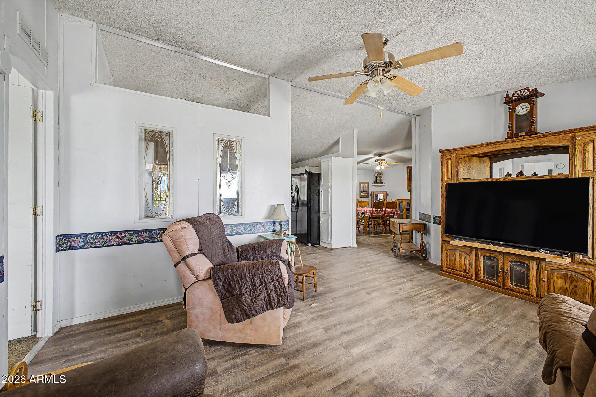 8595 North Palo Verde Road Florence, AZ 85132 - Photo 5 of 41 a living room with furniture and a flat screen tv