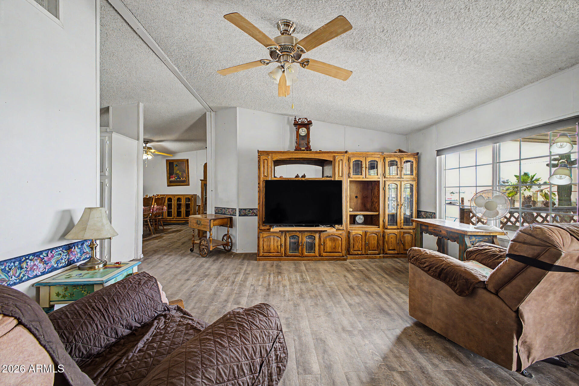 8595 North Palo Verde Road Florence, AZ 85132 - Photo 6 of 41 a living room with furniture and a flat screen tv