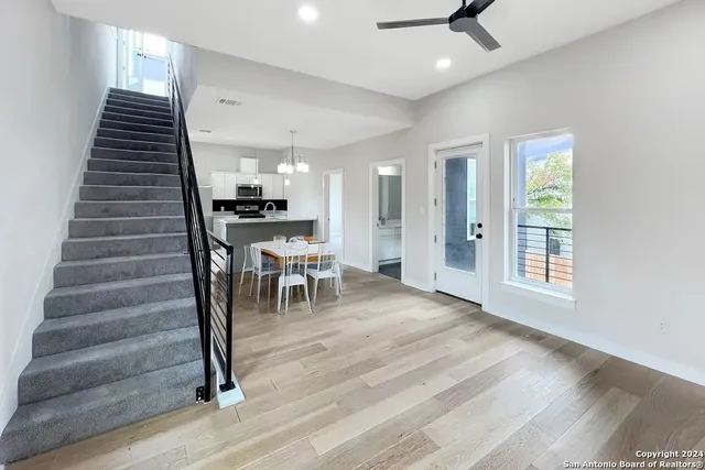a view of entryway and hall with wooden floor