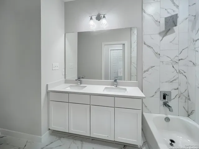 a bathroom with a sink and a bathtub