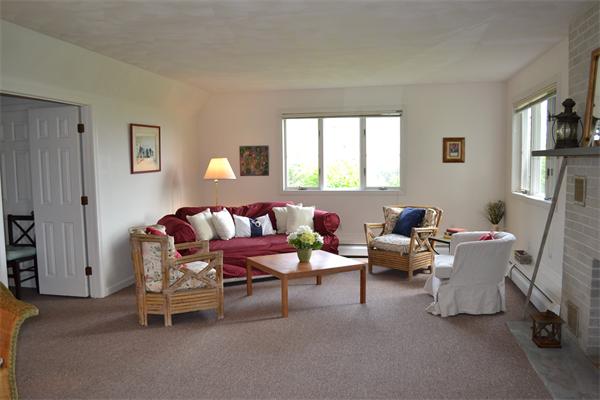 155 Sakonnet Point Road Little Compton, RI 02837 - Photo 12 of 15 a living room with furniture and a window