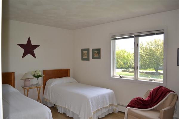 155 Sakonnet Point Road Little Compton, RI 02837 - Photo 15 of 15 a bedroom with bed and a window