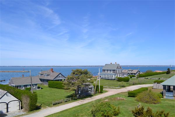 155 Sakonnet Point Road Little Compton, RI 02837 - Photo 2 of 15 an aerial view of a house with a garden