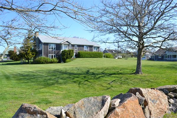 155 Sakonnet Point Road Little Compton, RI 02837 - Photo 3 of 15 a view of a house with a yard