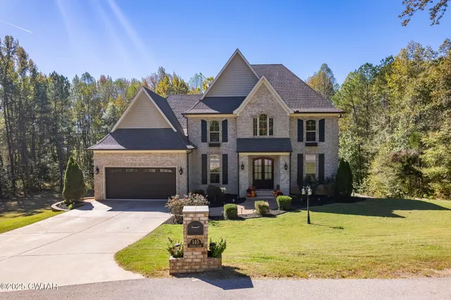 a front view of a house with swimming pool yard and outdoor seating