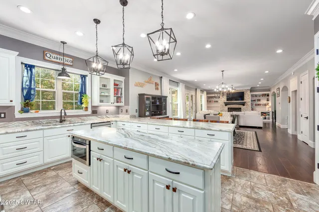 a view of a hallway with window and wooden floor