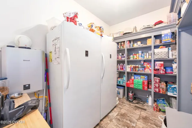 a bathroom with a sink a washer and dryer