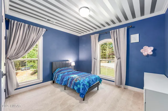 a bathroom with a double vanity sink mirror and bathtub
