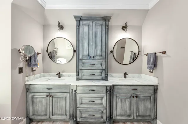 a view of roof deck with couches and wooden floor