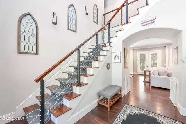 a living room with furniture fireplace and flat screen tv