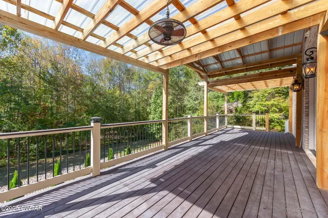 an aerial view of a houses with a yard