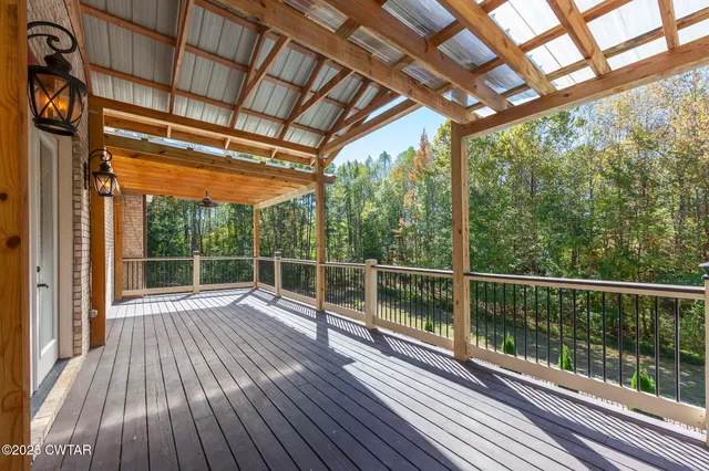 an aerial view of a houses with a yard