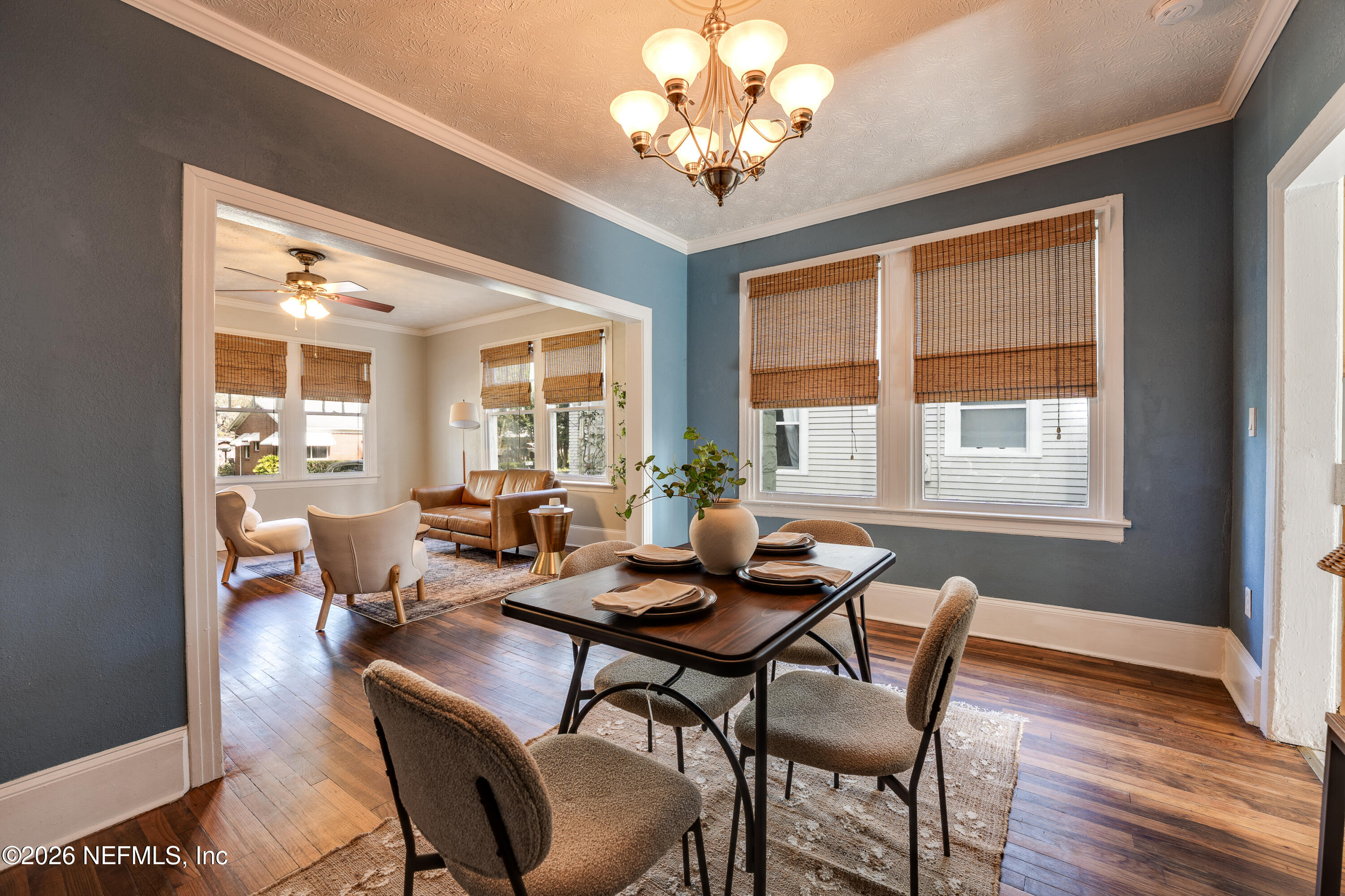 4560 French Street Jacksonville, FL 32205 - Photo 12 of 38 a view of a dining room with furniture wooden floor and chandelier
