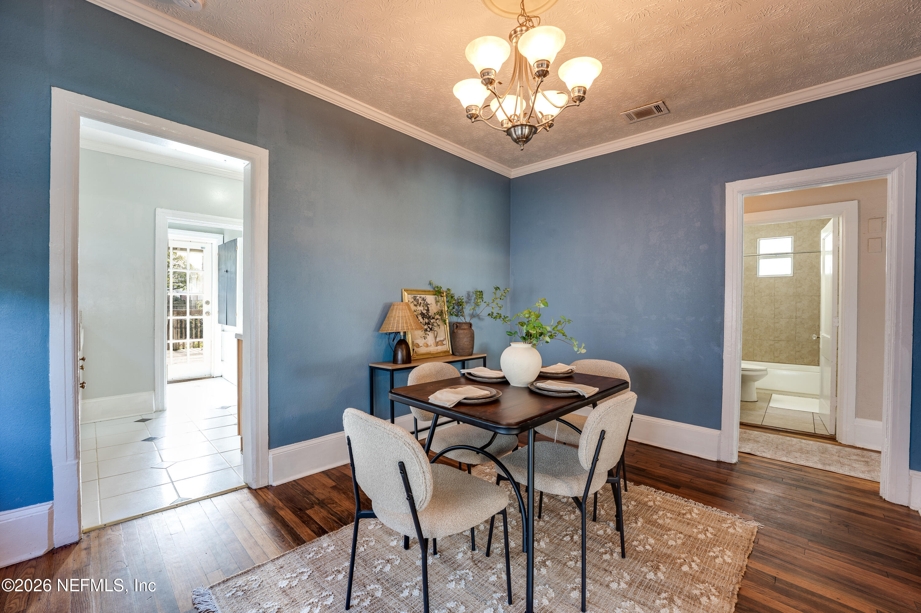 4560 French Street Jacksonville, FL 32205 - Photo 14 of 38 a view of a dining room with furniture and wooden floor