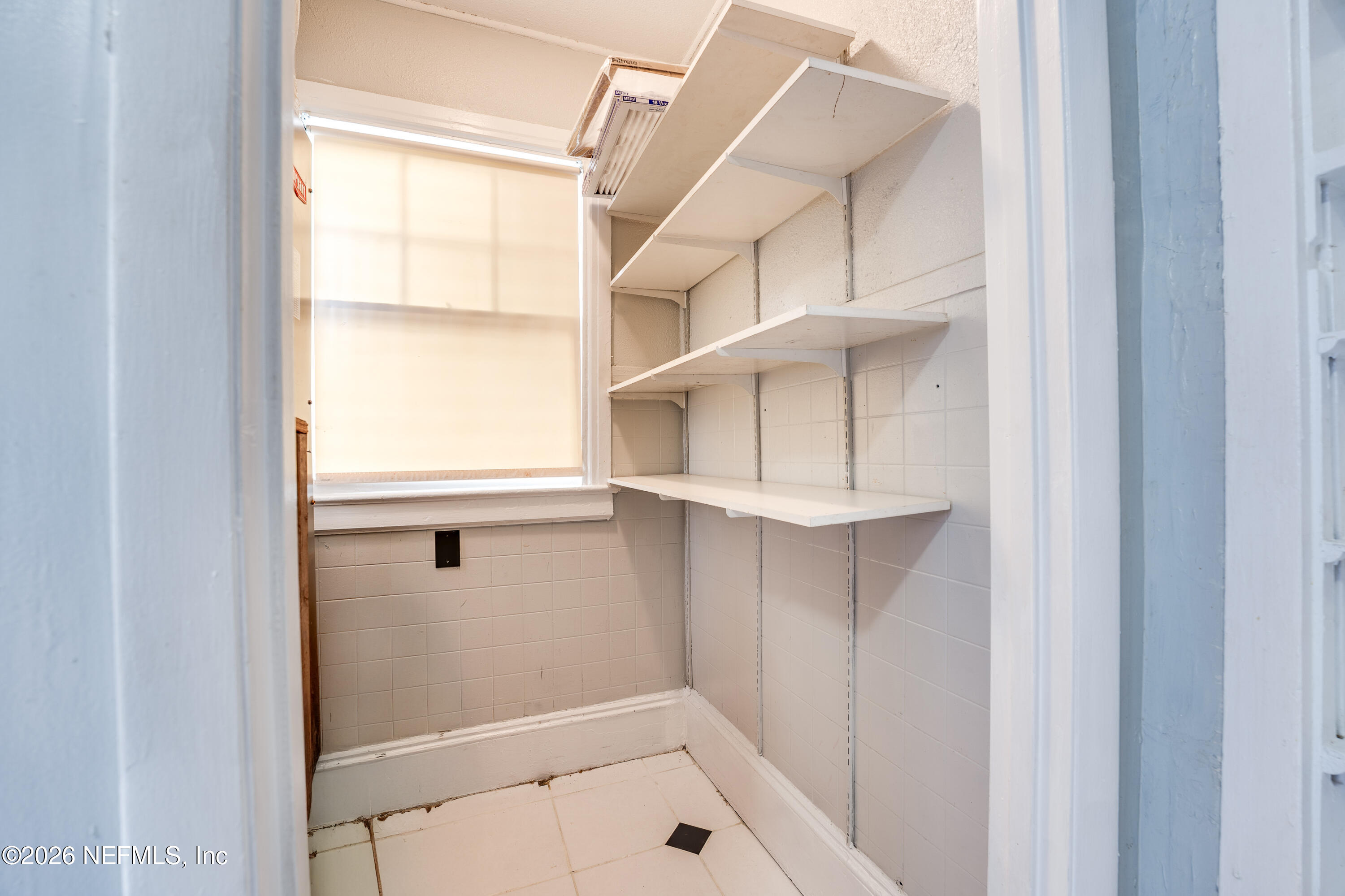 4560 French Street Jacksonville, FL 32205 - Photo 19 of 38 a bathroom with a window and a shower